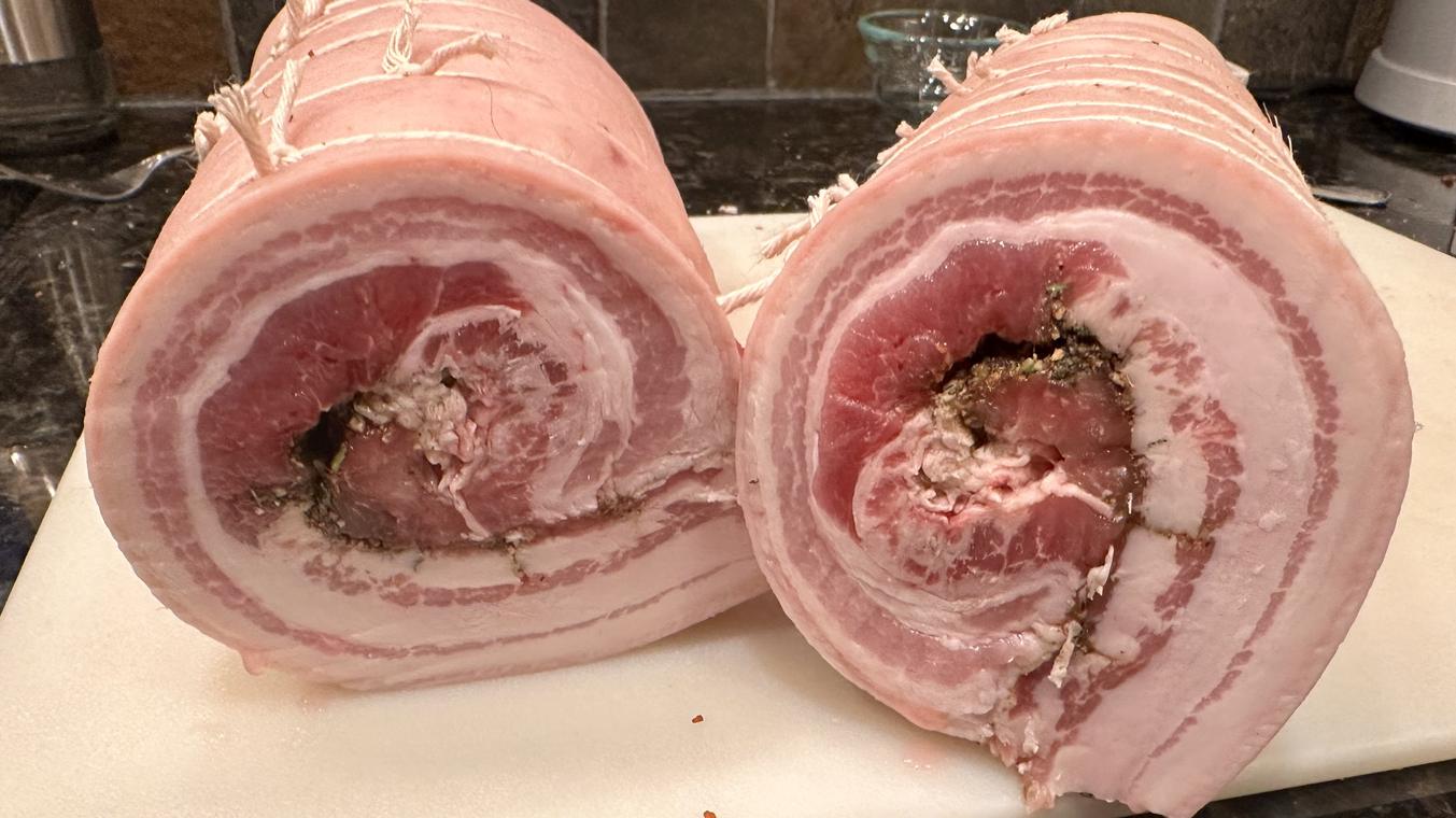 Porchetta sliced to show the spiral