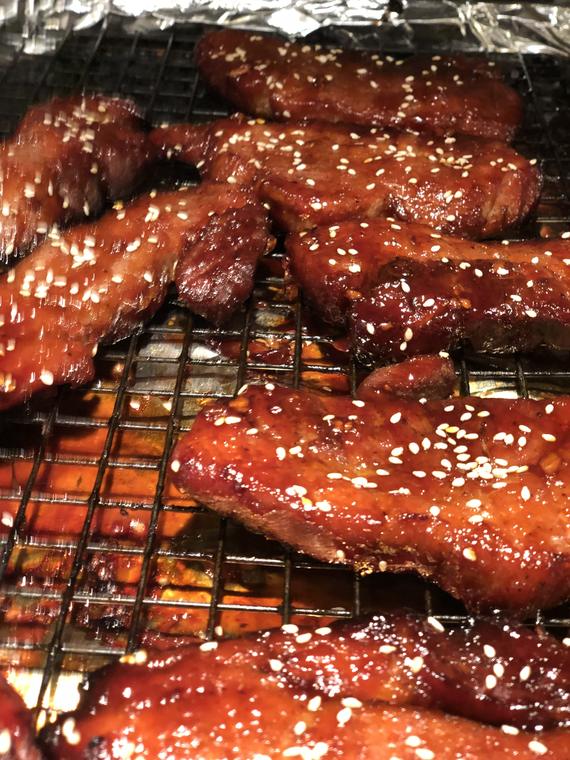 Sesame-glazed wings coming off the grill