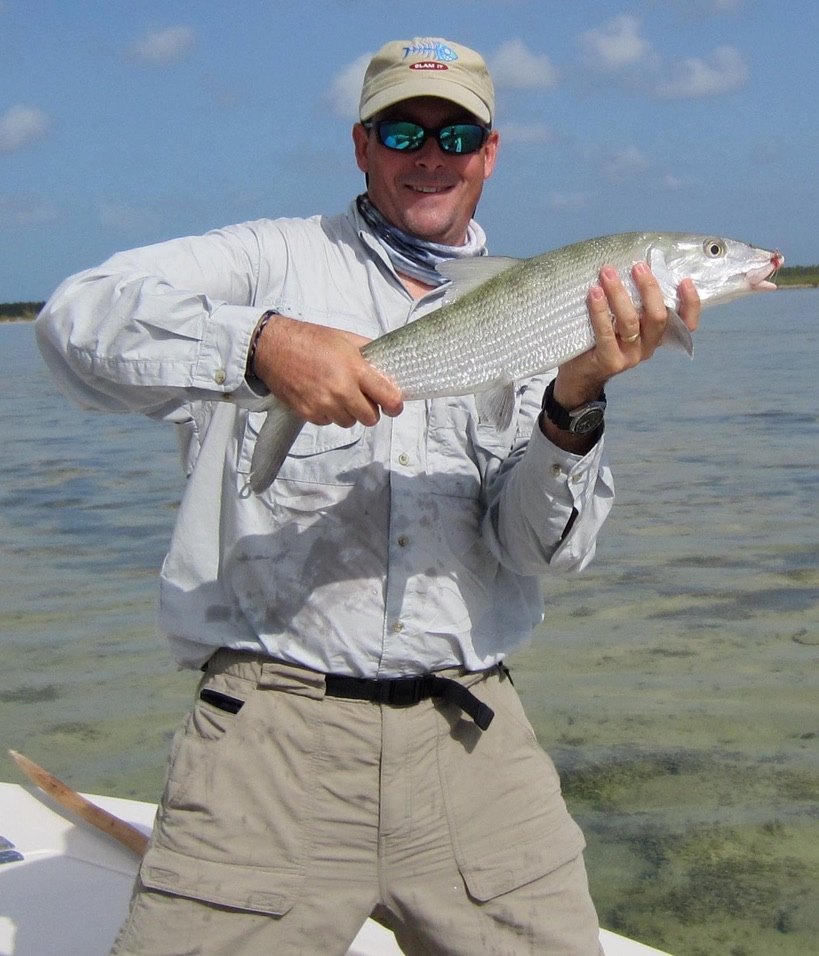 Brian on the flats holding a bonefish