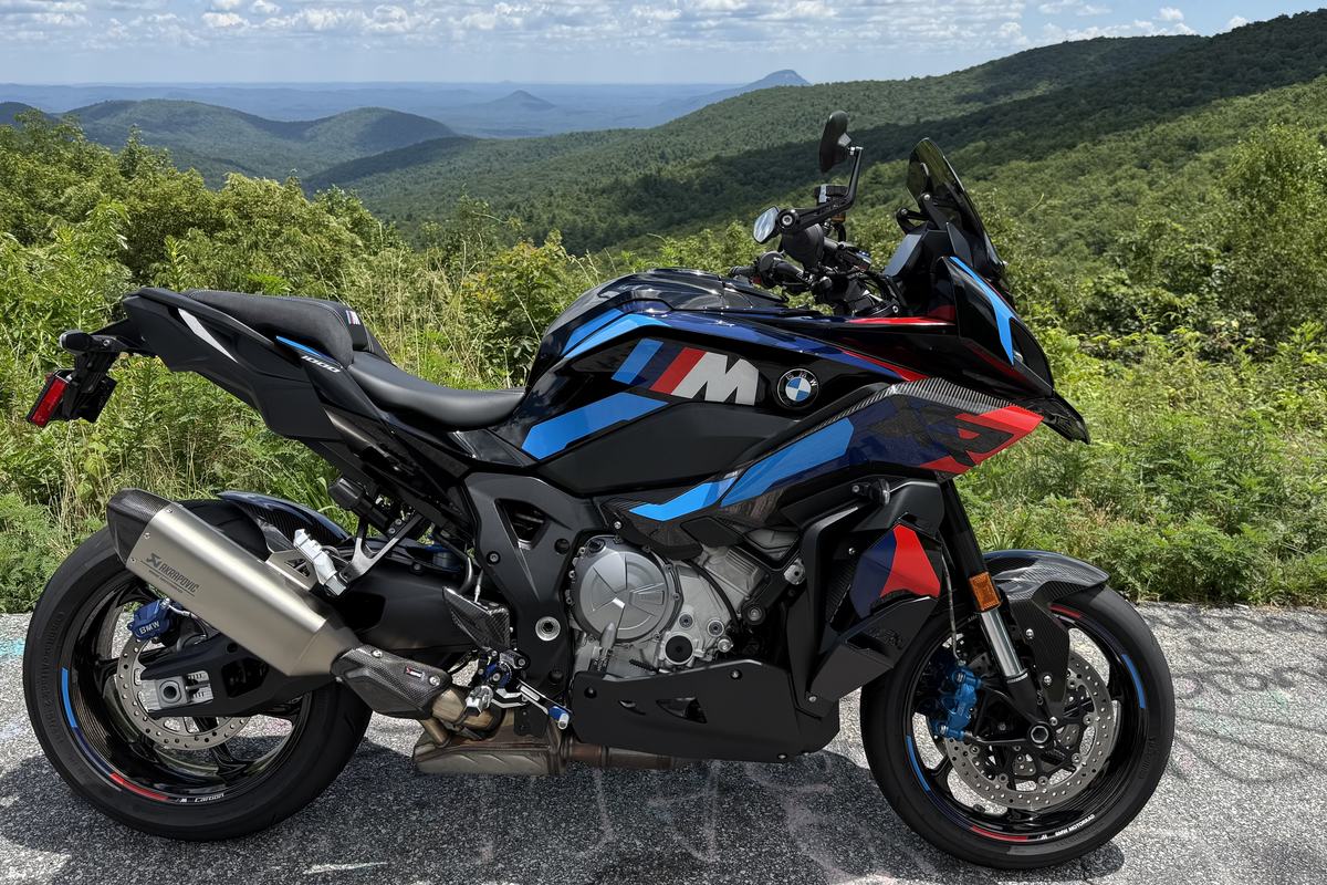 The BMW M 1000 XR on a Blue Ridge overlook with mountains behind it